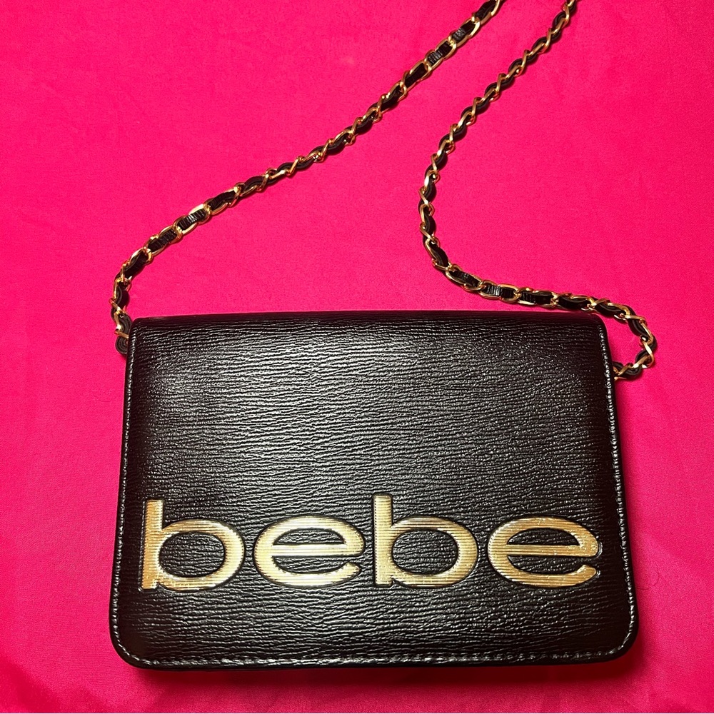 Black Bebe crossbody purse with gold hardware and logo on front